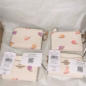 Beige Coach wallet 4 1/2" (L) x 3" (H) x 1/2" (W)